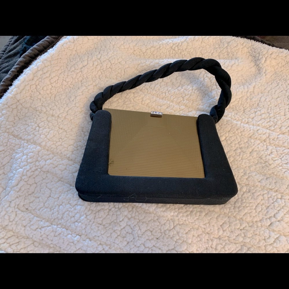 Unique vintage evening bag—black fabric with hard brass insert